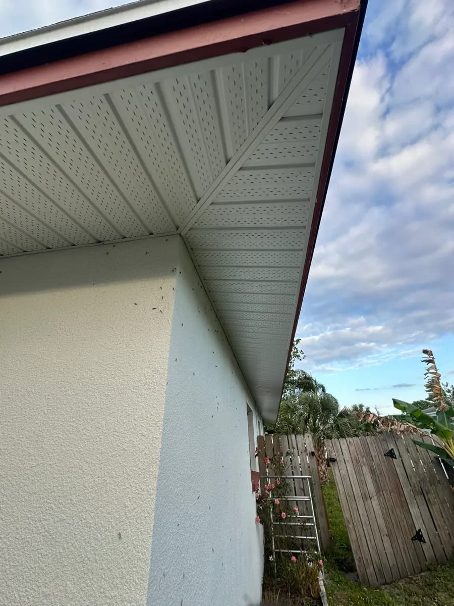 White vented soffit with red fascia installation - side view of completed project, Central Florida