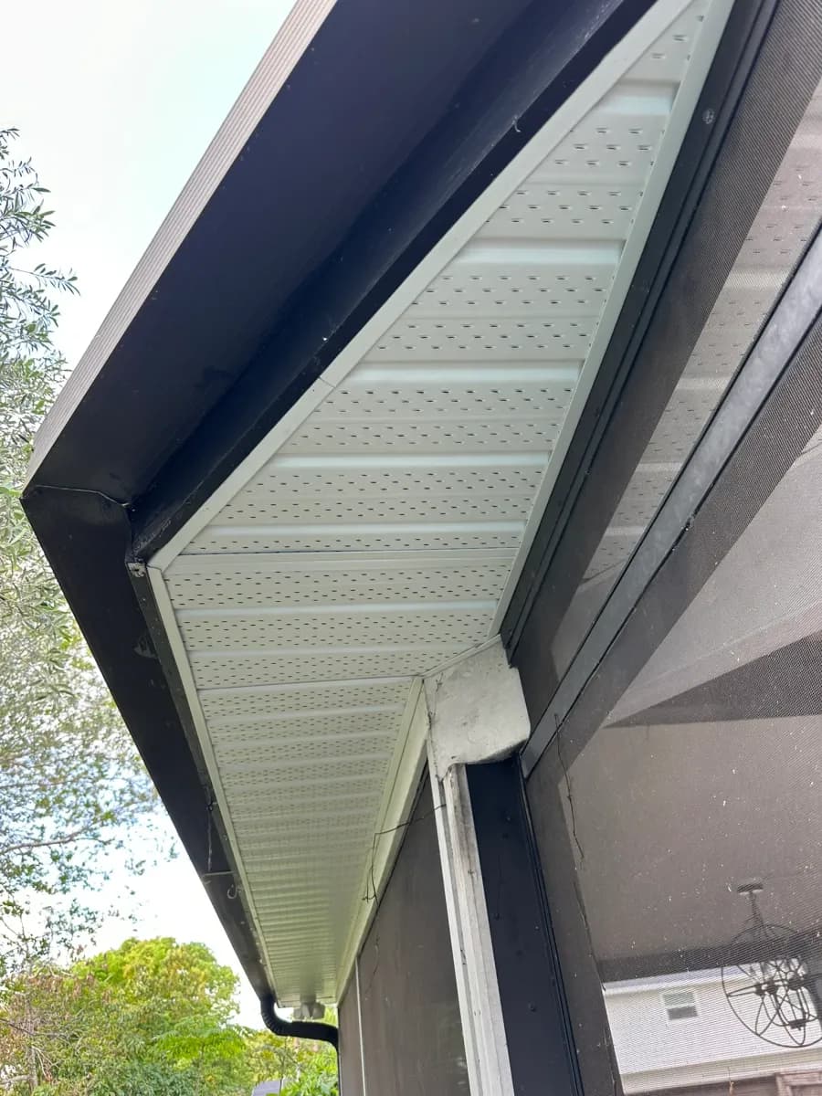 Vented soffit installation on gable triangle section inside screened porch - residential project